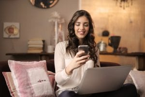 girl shopping online on couch